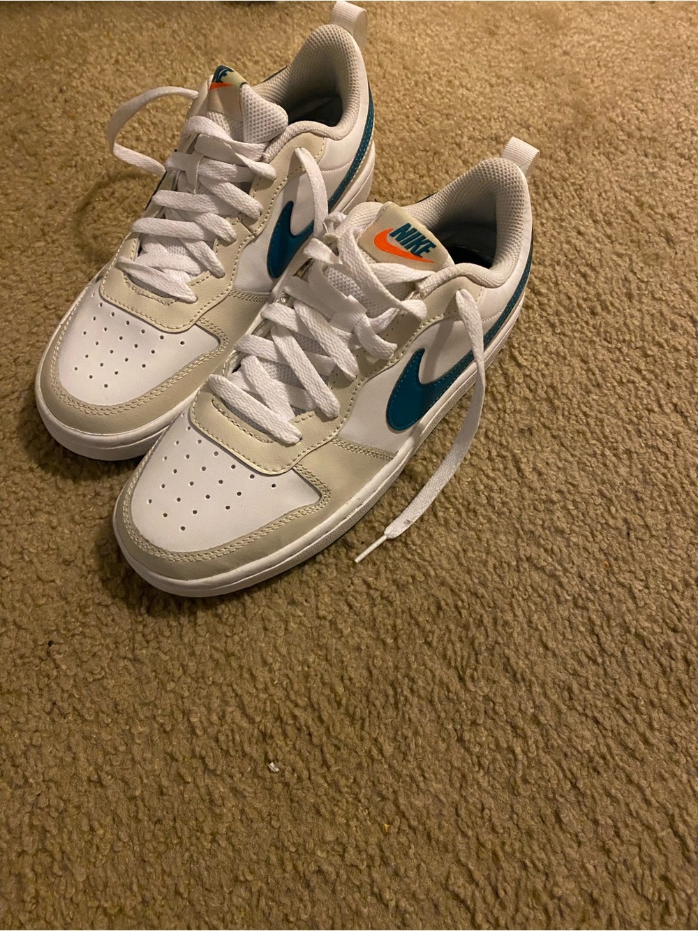 Nike Kids White Sneakers with Teal and Orange Accents